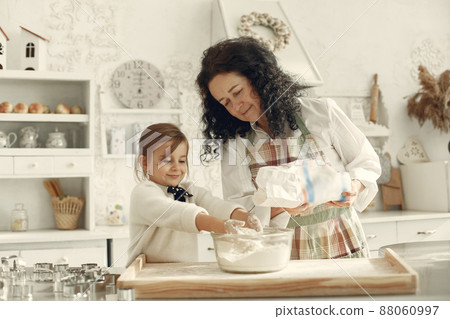 Family cook the dough for cookies 88060997