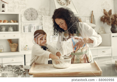 Family cook the dough for cookies 88060998