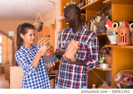 Young couple buys earthenware in a store 88061262