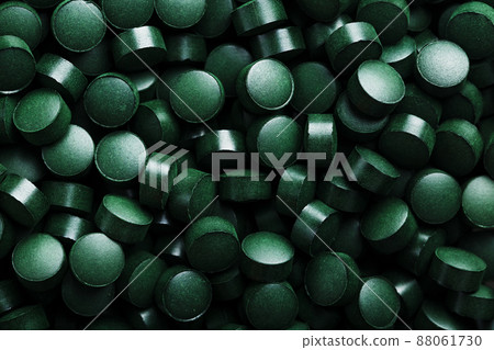 Close-up of Green tablets of organic spirulina Close-up of Green tablets of organic spirulina 88061730