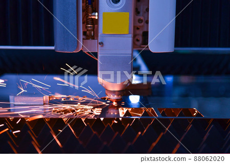 Industrial laser cut machine while cutting the sheet metal with the sparking light Industrial laser cut machine while cutting the sheet metal with the sparking light 88062020