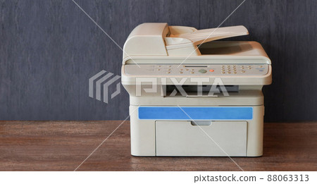 front view white and blue printer on wooden floor, grey wooden wall background,object, background,technology background, business, copy space front view white and blue printer on wooden floor, grey wooden wall background,object, background,technology background, business, copy space 88063313