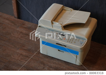 old white and blue printer on wooden floor background,object, background,technology background, business, copy space 88063318