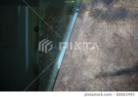 Blue glass banner over old distressed worn out wall background Blue glass banner over old distressed worn out wall background 88063493