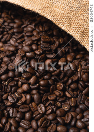 Roasted coffee beans and jute bags Roasted coffee beans and jute bags 88064748