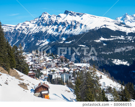 View towards Muerren, a village famous for winter sports in Switzerland, situated on a sunny terrace. 88066055