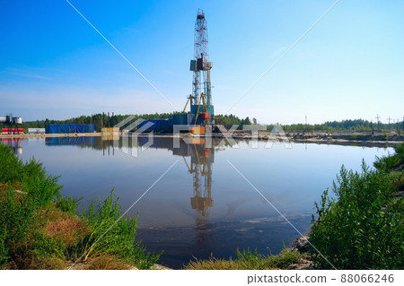 Drilling rig with reflection in the water. 88066246