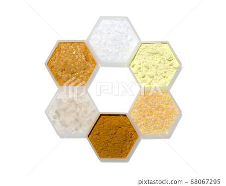 Chemical ingredient in hexagonal molecular shaped container. Microcrystalline Wax, Sulfur Powder, Candelilla Wax, Curcuma Powder, Flake Salt and Carnauba Wax Chemical ingredient in hexagonal molecular shaped container. Microcrystalline Wax, Sulfur Powder, Candelilla Wax, Curcuma Powder, Flake Salt and Carnauba Wax 88067295