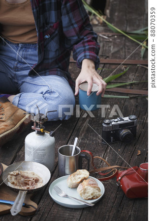 girl preparing breakfast on the pier 88070359
