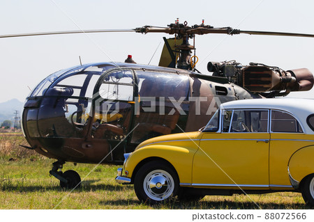 Light Military Helicopter With Yellow Classic Car 88072566