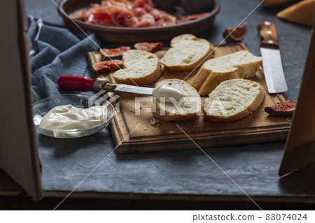 Making ham sandwiches Making ham sandwiches 88074024