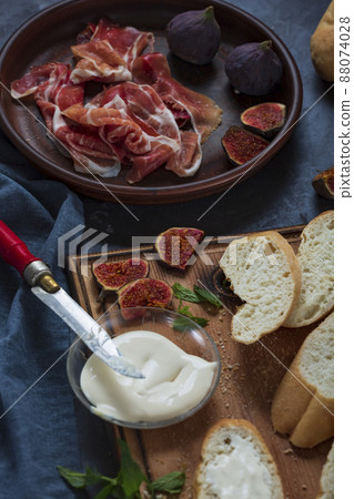 Making ham sandwiches Making ham sandwiches 88074028