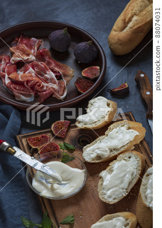 Making ham sandwiches 88074031