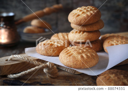 Homemade shortbread cookies with cinnamon and cezve for coffee break Homemade shortbread cookies with cinnamon and cezve for coffee break 88074331