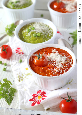 Vegetable appetizer: green pea souffle and tomato souffle 88075305