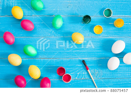 Colorful easter eggs on blue rustic wooden background Colorful easter eggs on blue rustic wooden background 88075457