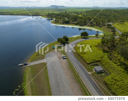 Fisherman Launching His Boat Ready For A Day On The Dam Fisherman Launching His Boat Ready For A Day On The Dam 88075978