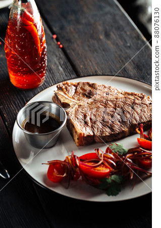 Grilled beef steak with vegetable garnish 88076130