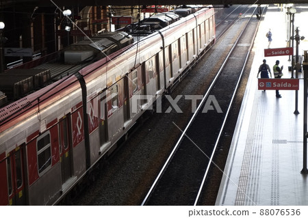public passenger trains and boarding platforms on Luz Station in Sao Paulo city. Historic building of the railway and subway station public passenger trains and boarding platforms on Luz Station in Sao Paulo city. Historic building of the railway and subway station 88076536