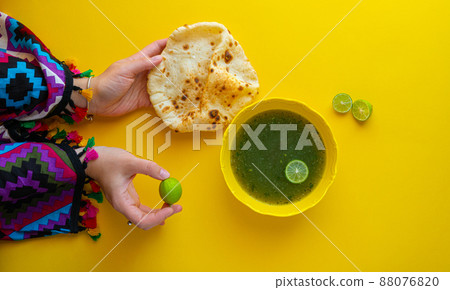 Woman eating traditional Egyptian Molokhia soup  88076820