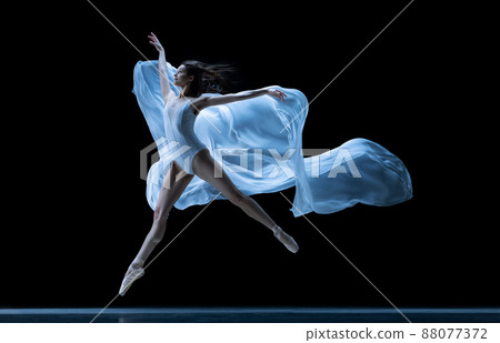 Graceful classic ballerina dancing with weightless fabric isolated on black studio background in neon. Theater, art, beauty, grace, action and motion concept. Graceful classic ballerina dancing with weightless fabric isolated on black studio background in neon. Theater, art, beauty, grace, action and motion concept. 88077372