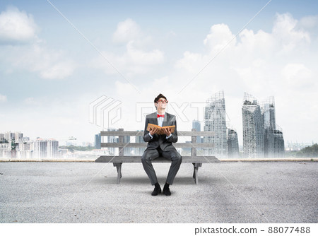 Young student with a book 88077488