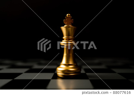 Golden Chess King standing alone on the chessboard Golden Chess King standing alone on the chessboard 88077616
