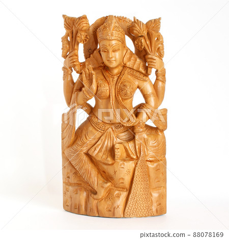 The wooden figure of God, a souvenir gift, India, in isolation 88078169
