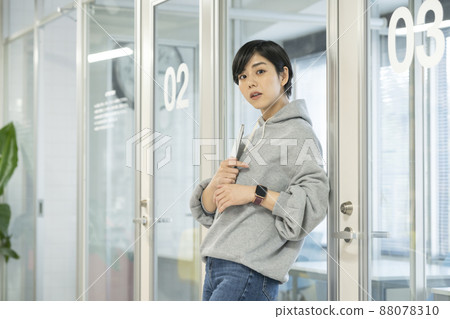 Young woman with laptop computer, casual business image 88078310