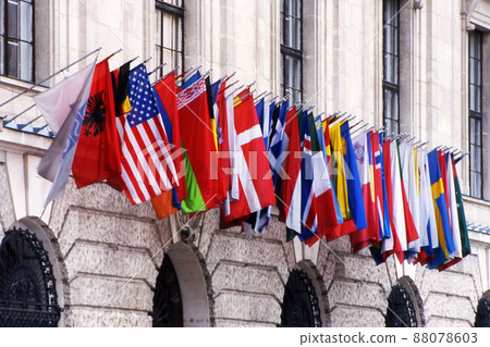 Flags of many nations on a building 88078603
