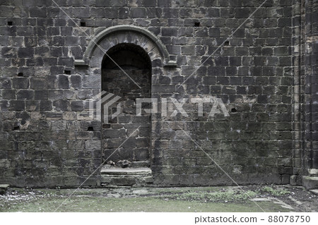 Bricked up doorway in an old gothic building Bricked up doorway in an old gothic building 88078750