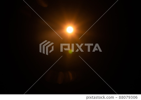 Solar lens flare on black background Solar lens flare on black background 88079306