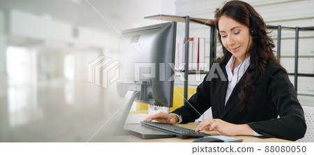 Business people wearing headset working in office broaden view Business people wearing headset working in office broaden view 88080050