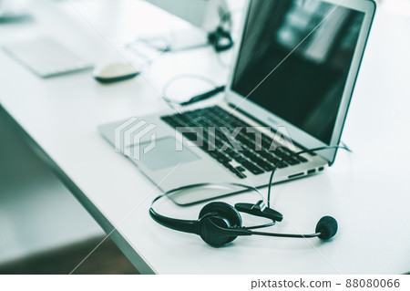 Headset and customer support equipment at call center ready for actively service 88080066
