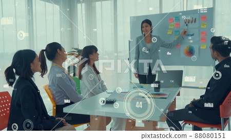 Business people in corporate staff meeting with envisional graphic Business people in corporate staff meeting with envisional graphic 88080151