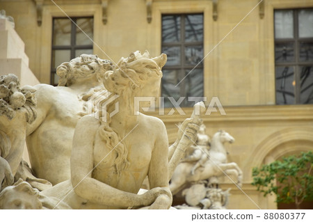Bronze statue of the Louvre Museum in Paris, France 88080377
