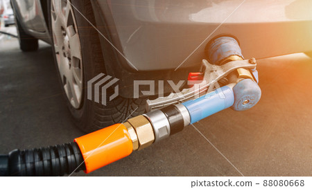Filling car petrol. Pump gas fuel at gasoline oil station for nozzle tank. Black handle of the refueling gun. 88080668