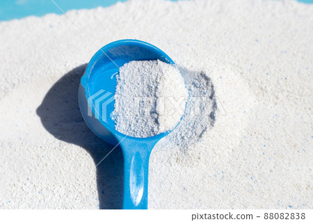 Detergent powder with measuring spoon for clothes washing. Laundry concept. 88082838