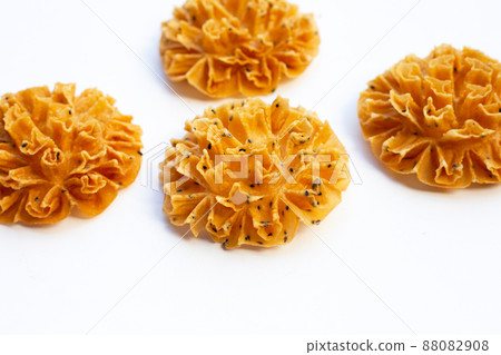 Crispy lotus blossom cookie in white background. Crispy lotus blossom cookie in white background. 88082908
