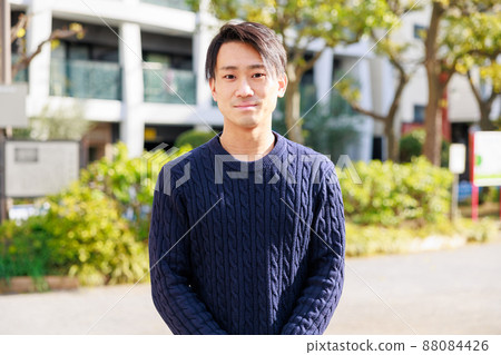 A good young Japanese smiling looking at the camera A good young Japanese smiling looking at the camera 88084426