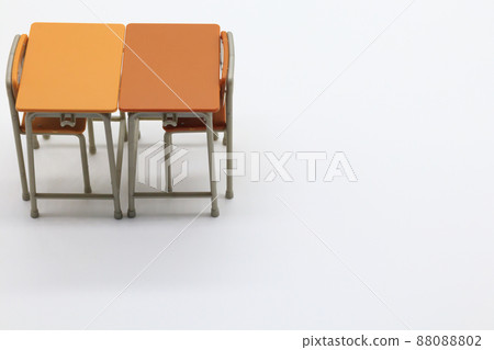 School desks and chairs facing each other 88088802