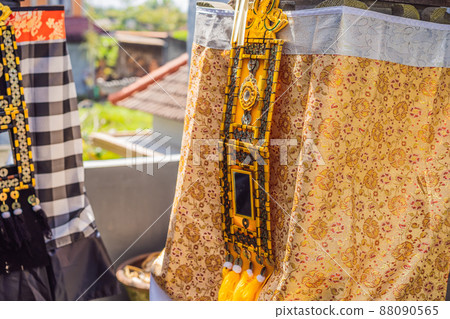 Traditional balinese offerings to gods in Bali with flowers and aromatic sticks 88090565