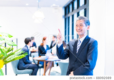 Elderly business person working with a smile 88092089