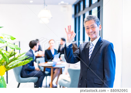 Elderly business person working with a smile Elderly business person working with a smile 88092091