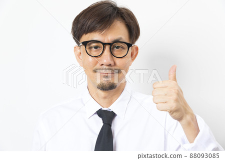 Asian businessman wearing glasses seriously thinking and pointing finger, eyes looking up gesture Asian businessman wearing glasses seriously thinking and pointing finger, eyes looking up gesture 88093085