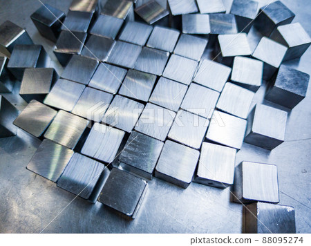 pile of small machined shiny steel cubes on metal surface pile of small machined shiny steel cubes on metal surface 88095274