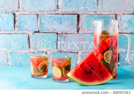 Fresh tasty delicious watermelon lemonade on a blue background Fresh tasty delicious watermelon lemonade on a blue background 88095561