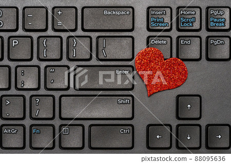 Valentines Day theme,red heart on laptop keyboard Valentines Day theme,red heart on laptop keyboard 88095636