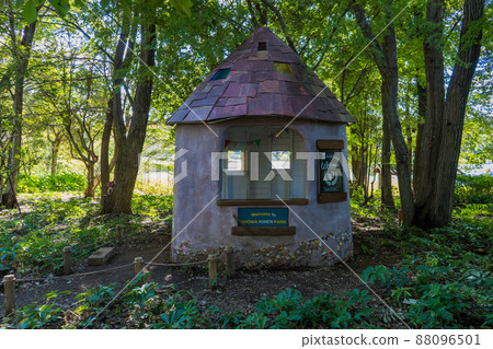 A small forest hut with a peaked roof A small forest hut with a peaked roof 88096501