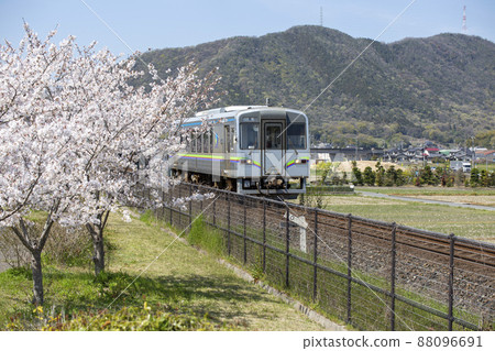 Train running through countryside 88096691